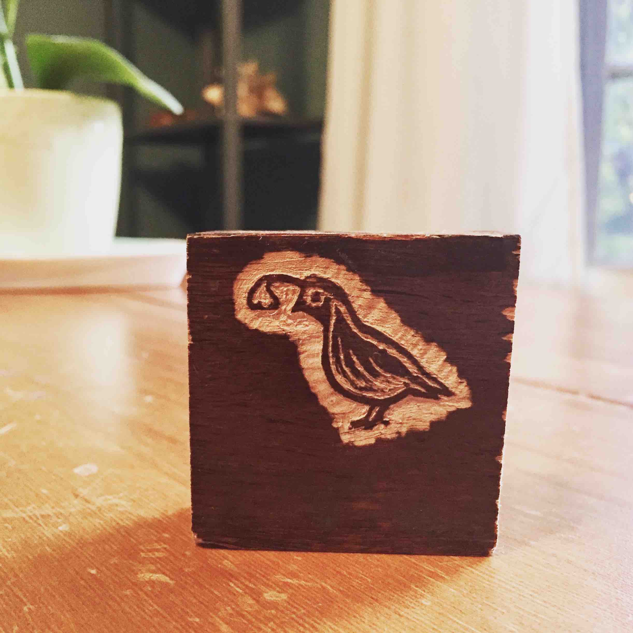 Quail stamp wood carving
